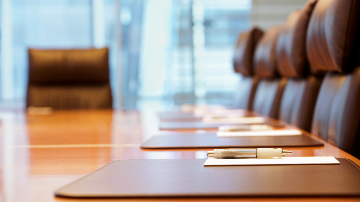 Boardroom with a long conference table and chairs.